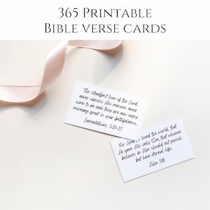 May include: White printable Bible verse cards with handwritten text, including verses from Lamentations and John. The cards are accompanied by a pale pink ribbon, perfect for daily inspiration and reflection.
