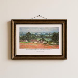 May include: Framed landscape art print featuring a field of red flowers and several white-roofed houses. The print is in a gold-colored frame and includes the quote, "FOR INDEED, A HOUSE IS A LITTLE CHURCH." by St. John Chrysostom.