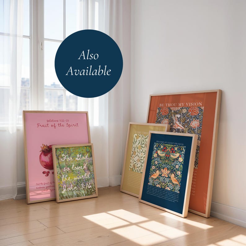 May include: Five framed art prints leaning against a wall. The prints feature various designs including a pink poster with a pomegranate, a green floral print with text, a yellow botanical print, and two dark blue and orange floral patterned posters.