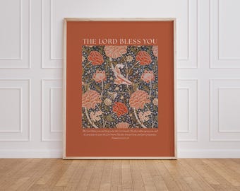 May include: A rectangular wall art print featuring a terracotta background with a central square panel displaying a dense floral pattern in shades of orange, cream, and dark blue. The text THE LORD BLESS YOU appears above the floral design.