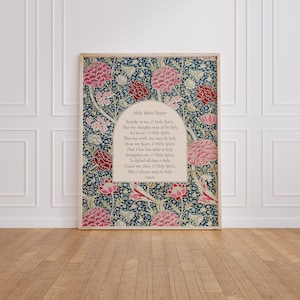 May include: A rectangular wall art print featuring a dark blue background with a dense floral pattern of pink and red flowers and green foliage. Centered is an arched cream-colored panel containing the text of the Holy Spirit Prayer.