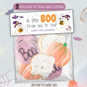 May include: A clear bag filled with Halloween-themed cookies. The cookies include ghost and pumpkin shapes, and some are decorated with the word "Boo!". A banner above reads "A little BOO From me to You! HAPPY HALLOWEEN!"