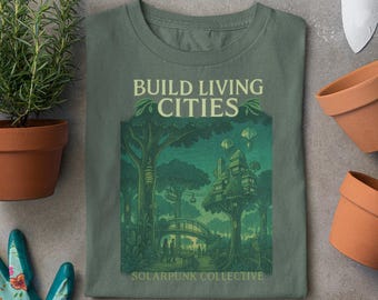 May include: Green t-shirt with a graphic of a treehouse city and the text "Build Living Cities" and "Solarpunk Collective".