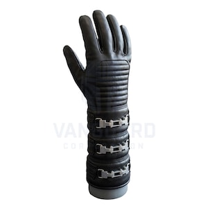 May include: Black leather glove with a long gauntlet design. The glove features quilted detailing on the back of the hand and forearm, with three silver-coloured metal buckle closures around the wrist area. The glove is displayed on a grey form.