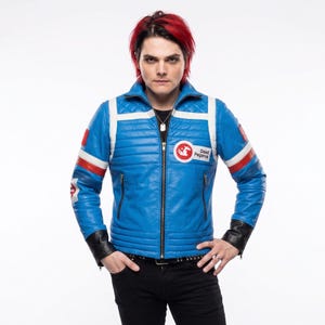 May include: A bright blue leather jacket featuring white and red horizontal stripes on the sleeves, a quilted chest panel, and a circular patch on the left side with a white pegasus graphic and the text Dead Pegasus in black lettering.