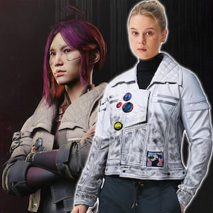 May include: Two jackets are shown. The first is a light grey quilted jacket with patches. The second is a light grey jacket with patches. Both jackets have a futuristic design. The background is dark.