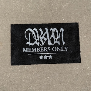 May include: Black doormat with white text that reads "D2AM MEMBERS ONLY" with three white stars below the text.