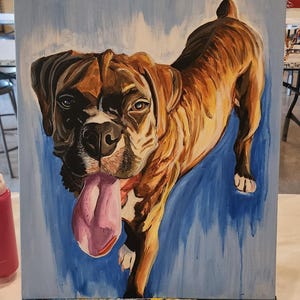 May include: A painting of a brown and black Boxer dog with its tongue sticking out. The dog is painted on a blue background.