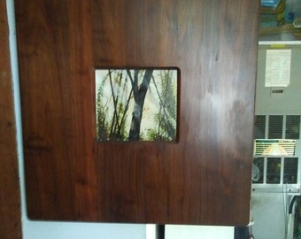 solid polished  walnut  frame very lovely with oil painting