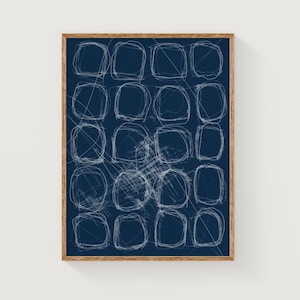 May include: A framed abstract art print with a navy blue background and white geometric shapes. The shapes are outlined in white and appear to be drawn with a light hand.