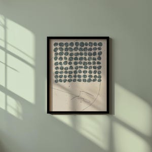 May include: A framed print with a black frame and a white background. The print features a grid of dark blue circles.