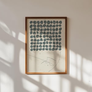 May include: A framed print with a minimalist design featuring a grid of blue circles on a cream background. The print has a simple, abstract style.