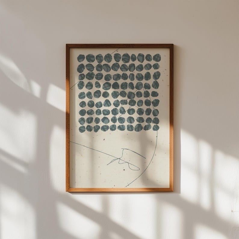 May include: A framed print with a minimalist design featuring a grid of blue circles on a cream background. The print has a simple, abstract style.