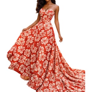 May include: A strapless, floor-length dress in a vibrant red hue, adorned with a repeating white floral pattern. The dress features a sweetheart neckline and a flowing skirt that extends into a train. The fabric appears lightweight and suitable for warm weather.