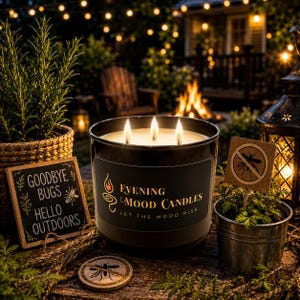 May include: A three-wick candle in a black glass jar with a label reading Evening Mood Candles Let The Mood Rise. Beside it sits a small sign saying Goodbye Bugs Hello Outdoors, a circular bug icon coaster, and a metal pot with a no-mosquito sign.