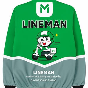 May include: Green and grey bomber jacket with the word "LINEMAN" in white. A cartoon character on a scooter is featured on the back. The jacket has a black hem and cuffs. The text in Thai is also visible.