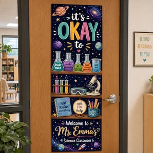 May include: A vertical door banner with a dark blue space theme featuring the text 'it's OKAY to' above colorful science beakers labeled with phrases like 'start over' and 'make mistakes'. It includes a microscope, notebook, and 'Welcome to Ms. Emma's Science Classroom' text.