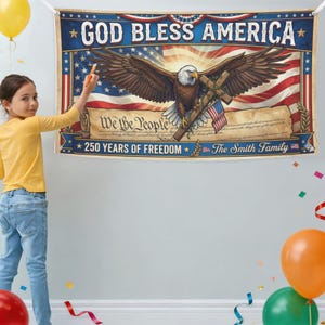 May include: A patriotic banner with the text "GOD BLESS AMERICA" and "250 YEARS OF FREEDOM". The banner features an eagle with outstretched wings, a cross, and the American flag. The words "We the People" are also displayed.