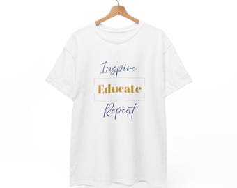 May include: White t-shirt with the text "Inspire Educate Repeat" in blue and gold lettering.