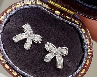 Aretes de diamantes con nudo de lazo en oro de 18 quilates: diamantes sudafricanos