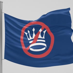 May include: A blue flag waving in the wind, featuring a white crown inside a red circle with a red slash through it. The flag is mounted on a silver pole.