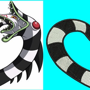 May include: A black and white striped heart-shaped design featuring a cartoon character with a green and white face, red eye, and sharp teeth. The design is reminiscent of a popular movie character.