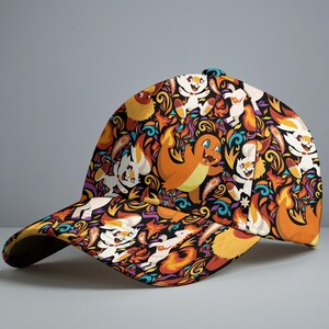 May include: A baseball cap featuring a vibrant pattern of orange, white, and yellow cartoon characters on a black background. The cap has a curved brim and a classic six-panel design, perfect for sun protection.