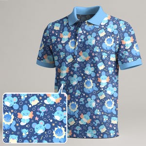 May include: A blue polo shirt featuring a repeating pattern of cartoon characters in shades of blue, yellow, and orange. The shirt has a light blue collar and sleeve cuffs. A smaller, detailed view of the pattern is shown in the lower left corner.