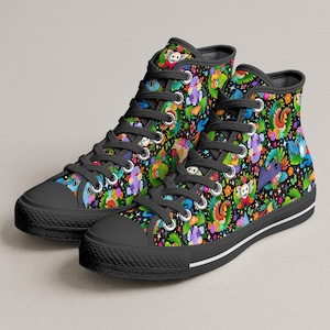 May include: A pair of black high-top trainers featuring a vibrant, multi-coloured pattern of various cartoon creatures, tropical leaves, and bright flowers against a dark background. The shoes have black laces, silver metal eyelets, and black rubber soles.