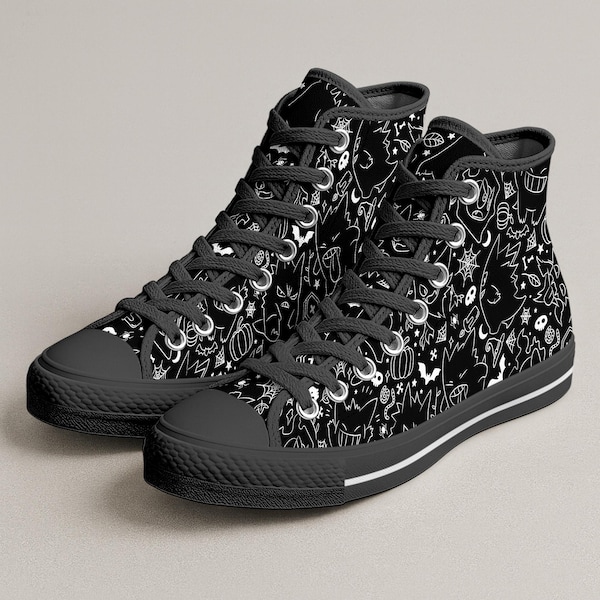 May include: Black high-top sneakers with a white Halloween-themed pattern. The sneakers feature a black toe cap, laces, and sole. The white pattern includes bats, pumpkins, and other spooky elements. A white stripe accents the sole.