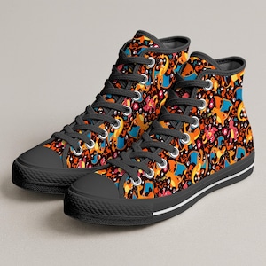May include: A pair of high-top sneakers featuring a black background with a repeating pattern of orange, blue, and red dragon-like creatures. The shoes have black laces, silver metal eyelets, a black rubber toe cap, and a black sole with a white stripe.