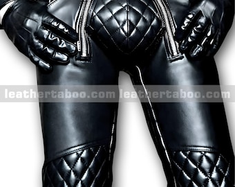 May include: Black leather pants with quilted diamond pattern details and silver zippers. The pants have a fitted design and are worn with black gloves. The website leather taboo .com is printed on the pants.