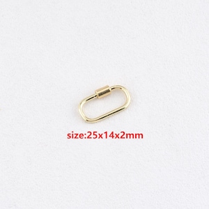 May include: Gold-toned metal oval-shaped clasp measuring 25x14x2mm.