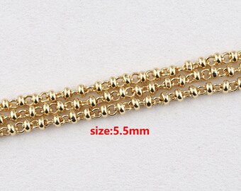 May include: Close-up of three strands of gold-coloured chain. The chain links are a combination of small, round beads and elongated oval links. The text "size: 5.5mm" is visible in the image.