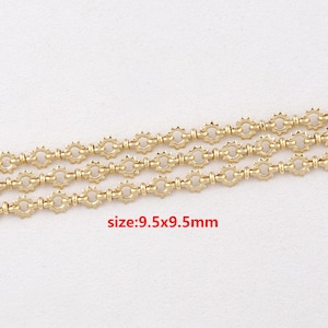 May include: Gold-colored chain with a repeating sunburst design. The chain links are connected by small, round beads. The text "size: 9.5x9.5mm" is visible in red. This jewelry chain is suitable for necklaces, bracelets, and other craft projects.