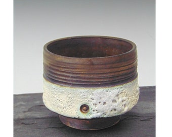 Volcanic textured bowl with manganese bronze band