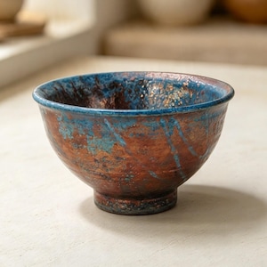 Small mottled  copper raku bowl