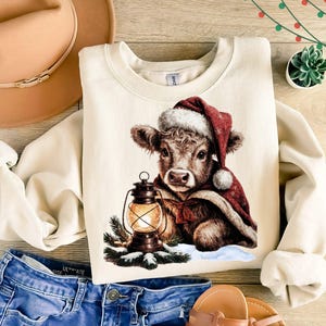 Highland Cow Christmas PNG, Baby Cow Sled Holiday Clipart, Farmhouse Rustic Christmas Digital Download for Shirts, Mugs & Decor
