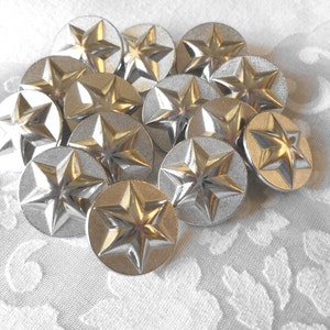 May include: A group of silver-toned metal buttons with a five-pointed star design.