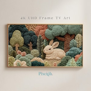 Puede incluir: Una obra de arte enmarcada que representa una escena de bosque texturizada con un conejo beige. La obra de arte incluye árboles en tonos de verde, marrón y naranja. El texto "4K UHD Frame TV Art" se muestra en la parte superior.