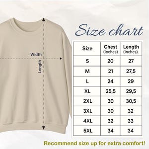 May include: A beige sweatshirt with a size chart. The chart shows chest and length measurements in inches for sizes S to 5XL. The text recommends sizing up for extra comfort. The words "Size chart" are written in cursive.