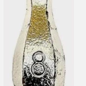 May include: A silver-colored fishing weight with a rounded bottom and a loop at the top. The number "8" is embossed on the front. The weight has a teardrop shape and is likely used for angling.