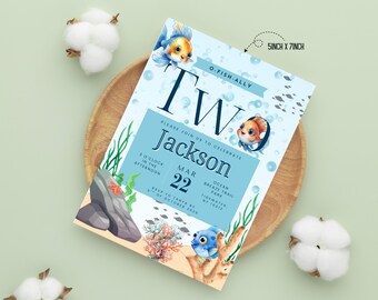 May include: A light blue invitation card, 5 inches by 7 inches, with an underwater theme. The card features the text "TW" and "Jackson", along with the date March 22. Illustrations of fish, coral, and seaweed decorate the card.