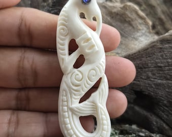 Hand-Carved Bone Manaia Pendant with Abalone Eye Detail