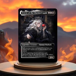 May include: A black and white illustration of a woman with white hair wearing a black dress and a crown. She is holding a red apple in her hand. The text "Eriette of the Charmed Apple 100" is at the top of the card. The text "Legendary Creature - Human Warlock" is below the image. The text "Each creature that's enchanted by an Aura you control can't attack you or planeswalkers you control. At the beginning of your end step, each opponent loses X life and you gain X life, where X is the number of Auras you control. 2/4" is at the bottom of the card.