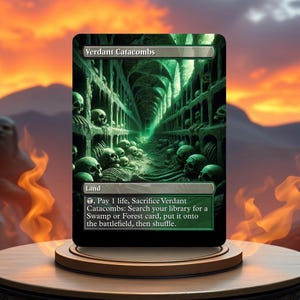 May include: A Magic: The Gathering card called "Verdant Catacombs". It is a green and black land card with an illustration of a dark, skeletal catacomb. The card text reads: "Land, , Pay 1 life, Sacrifice Verdant Catacombs: Search your library for a Swamp or Forest card, put it onto the battlefield, then shuffle."