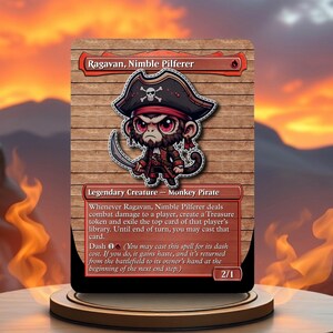 May include: A fantasy trading card featuring a cartoon monkey pirate with a red bandana and a skull and crossbones on its hat. The card is titled "Ragavan, Nimble Pilferer" and has the text "Legendary Creature - Monkey Pirate".