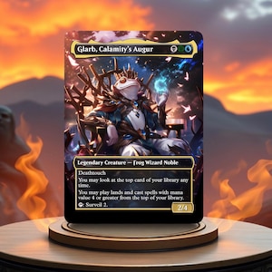 May include: A fantasy trading card featuring a green, blue, and white frog wearing a crown and a blue and black robe. The card is titled "Glarb, Calamity's Augur" and has the text "Legendary Creature - Frog Wizard Noble".