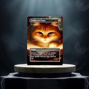 May include: A Magic: The Gathering card with a golden background and a cat looking at a book. The card is titled "Enlightened Tutor" and reads "Instant. Search your library for an artifact or enchantment card, reveal it, then shuffle and put that card on top."