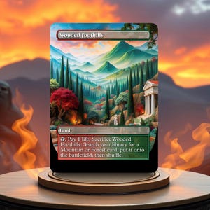 May include: A Magic: The Gathering card called "Wooded Foothills". It is a land card with a green, blue, and brown illustration of a wooded area with a mountain in the background. The card text reads: "Pay 1 life, Sacrifice Wooded Foothills: Search your library for a Mountain or Forest card, put it onto the battlefield, then shuffle."
